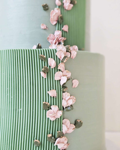Green petal cake with small rose petals