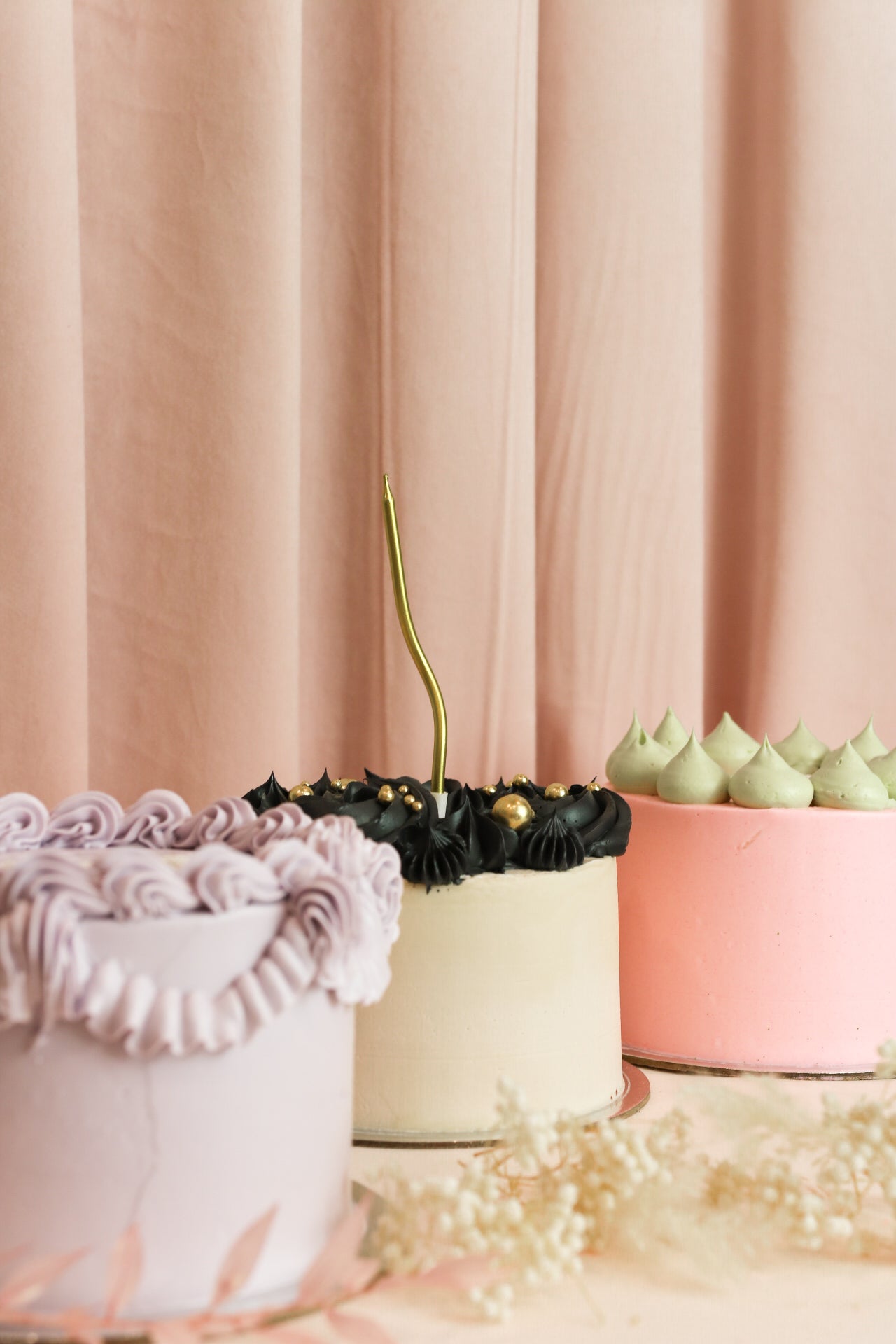 Three bento cakes with different decor